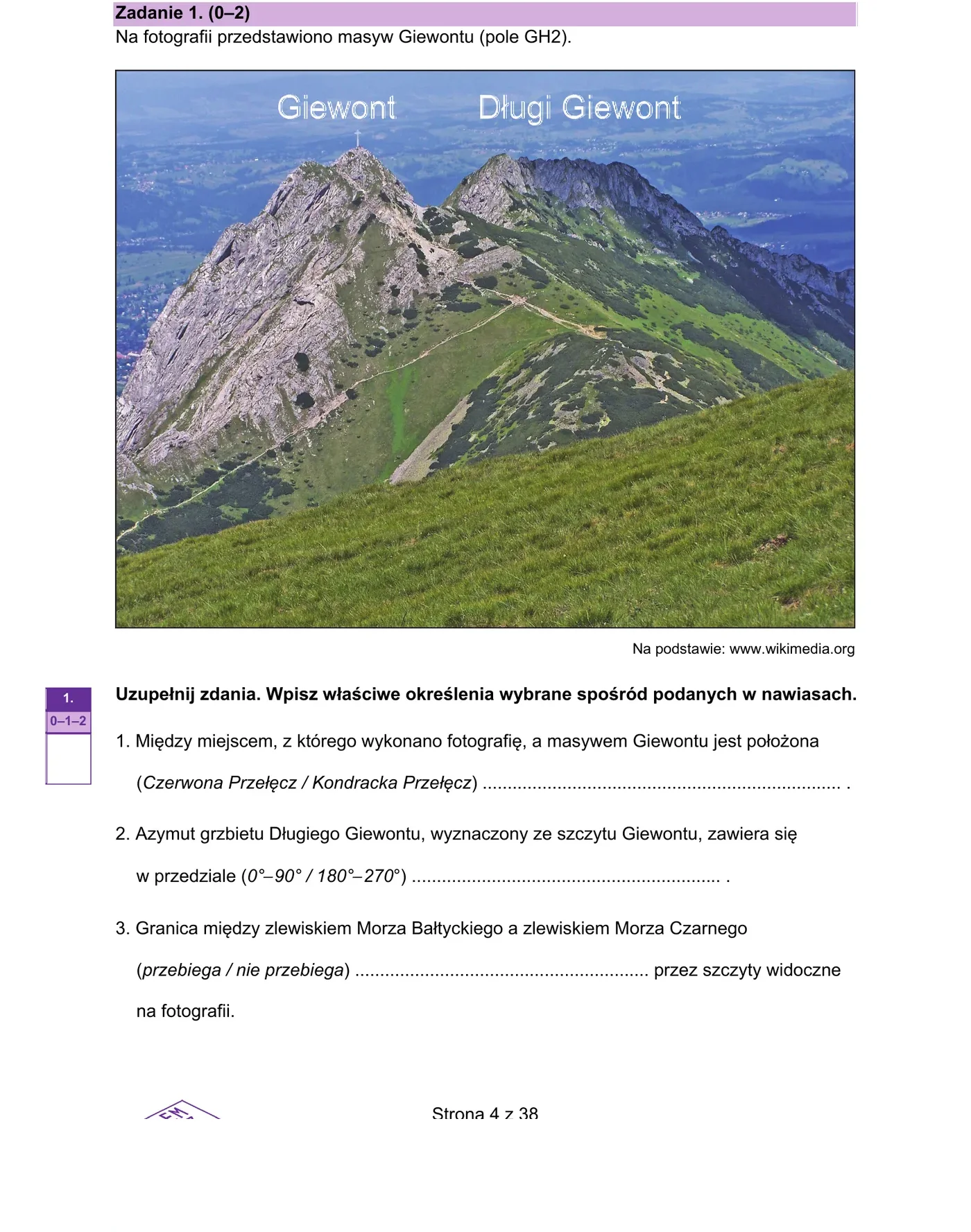 Fotografia masywu Giewontu z podpisanymi szczytami Giewont i Długi Giewont